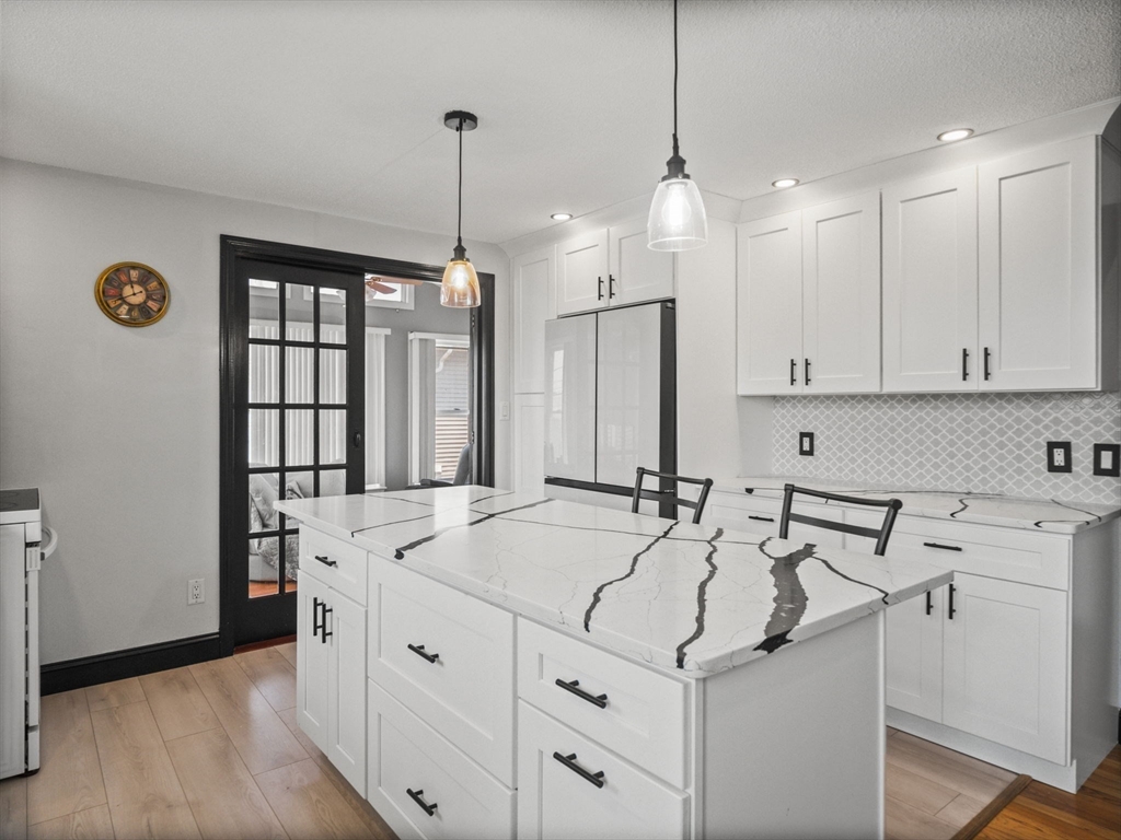 146 Lisbon Street Fall River, MA 02721 - Photo 4 of 42 a view of a kitchen with stainless steel appliances granite countertop a sink and a refrigerator