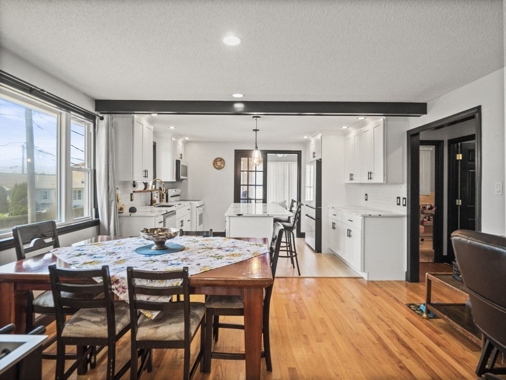 146 Lisbon Street Fall River, MA 02721 - Photo 8 of 42 a view of a dining room with furniture and wooden floor