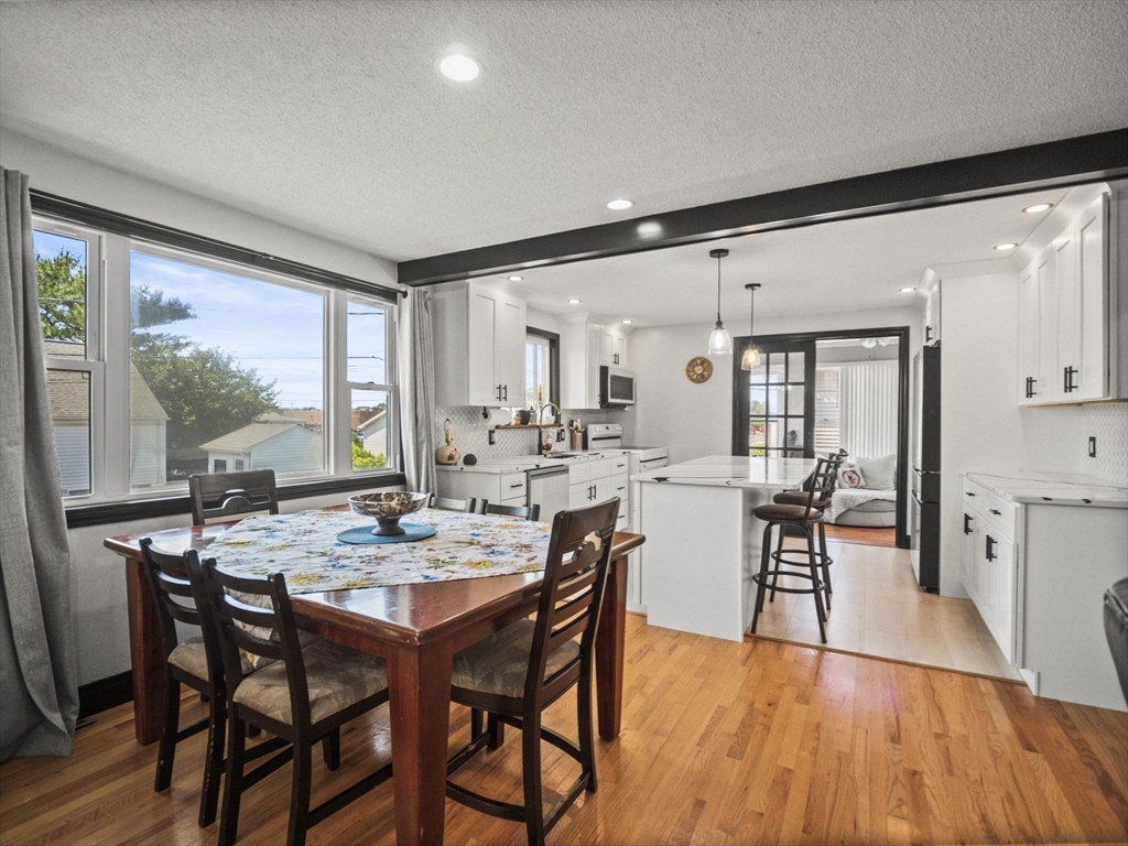 146 Lisbon Street Fall River, MA 02721 - Photo 9 of 42 a view of a dining room with furniture and wooden floor