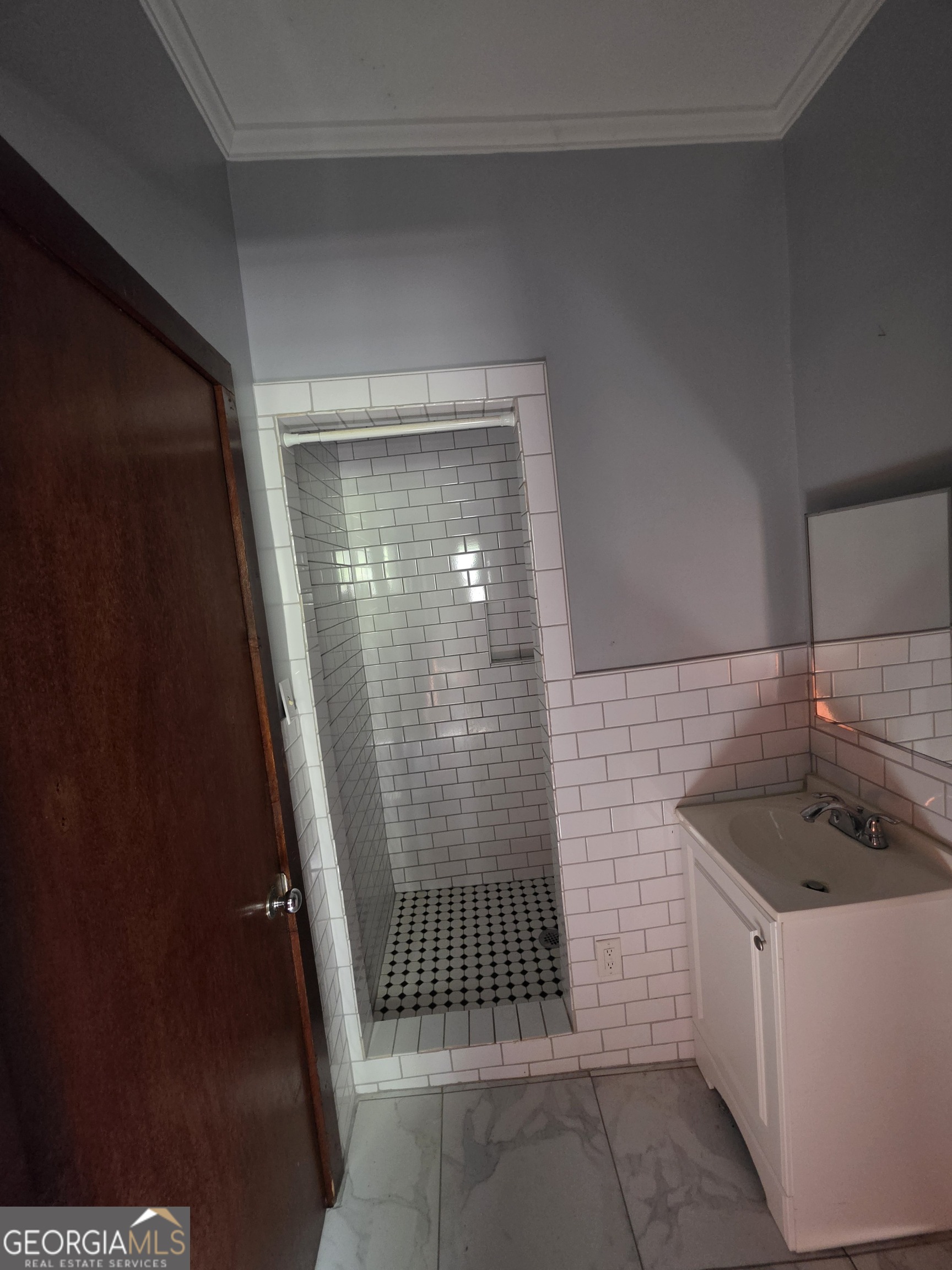 109 Springdale Drive Washington, GA 30673 - Photo 27 of 35 a bathroom with a sink and shower