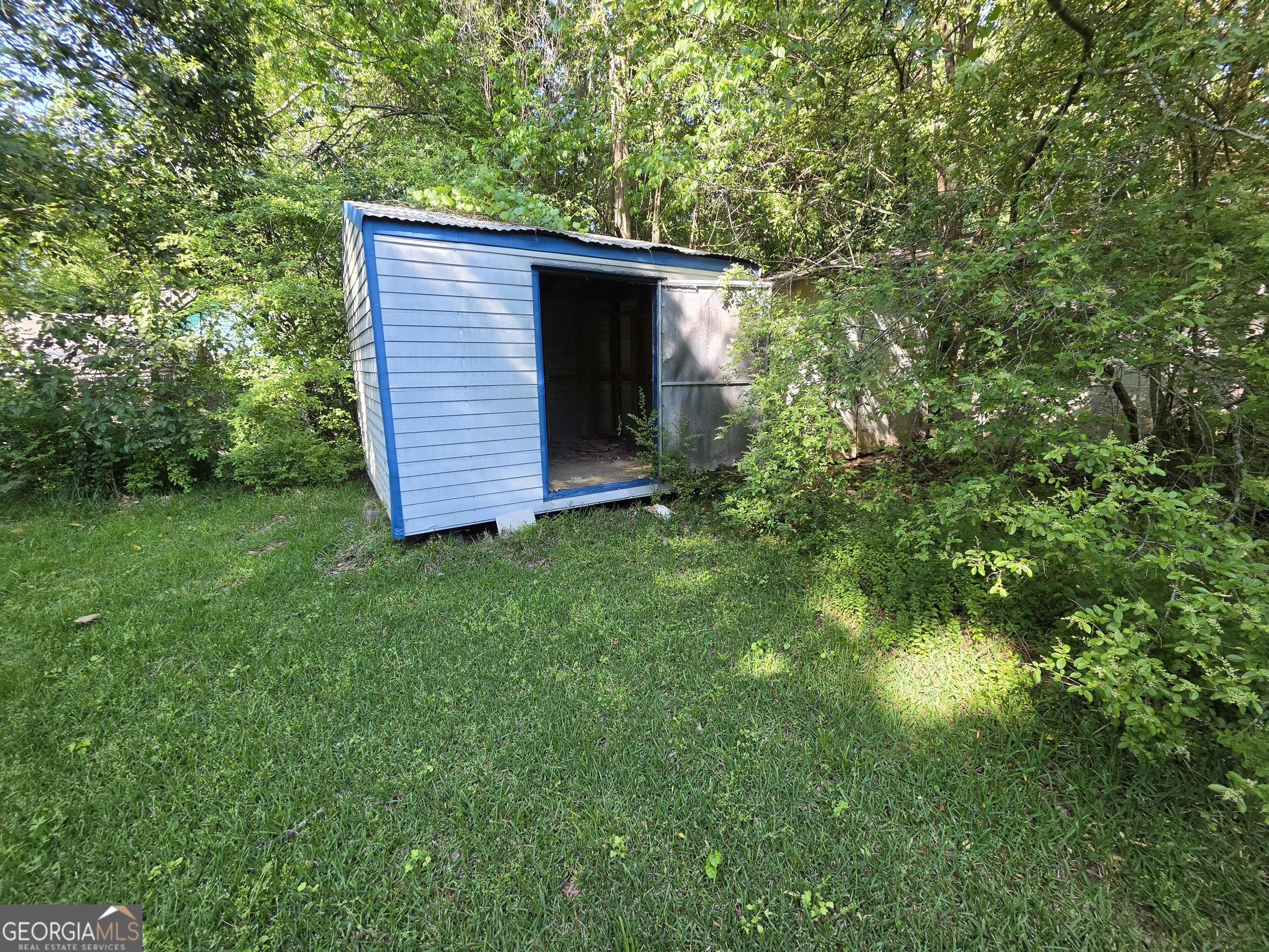 109 Springdale Drive Washington, GA 30673 - Photo 32 of 35 a view of a wooden door and a yard