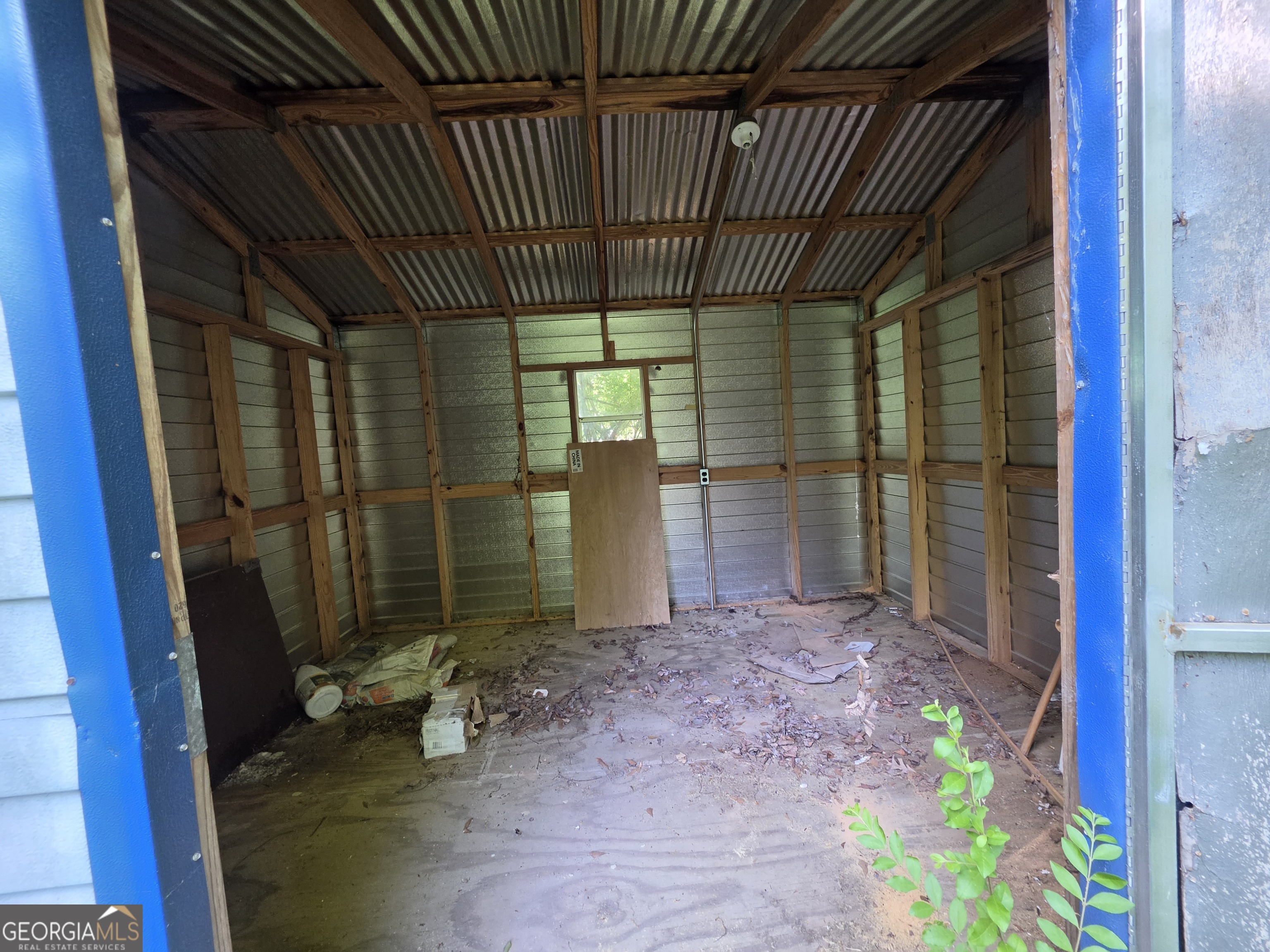 109 Springdale Drive Washington, GA 30673 - Photo 35 of 35 a view of a room with sliding door and wooden floor