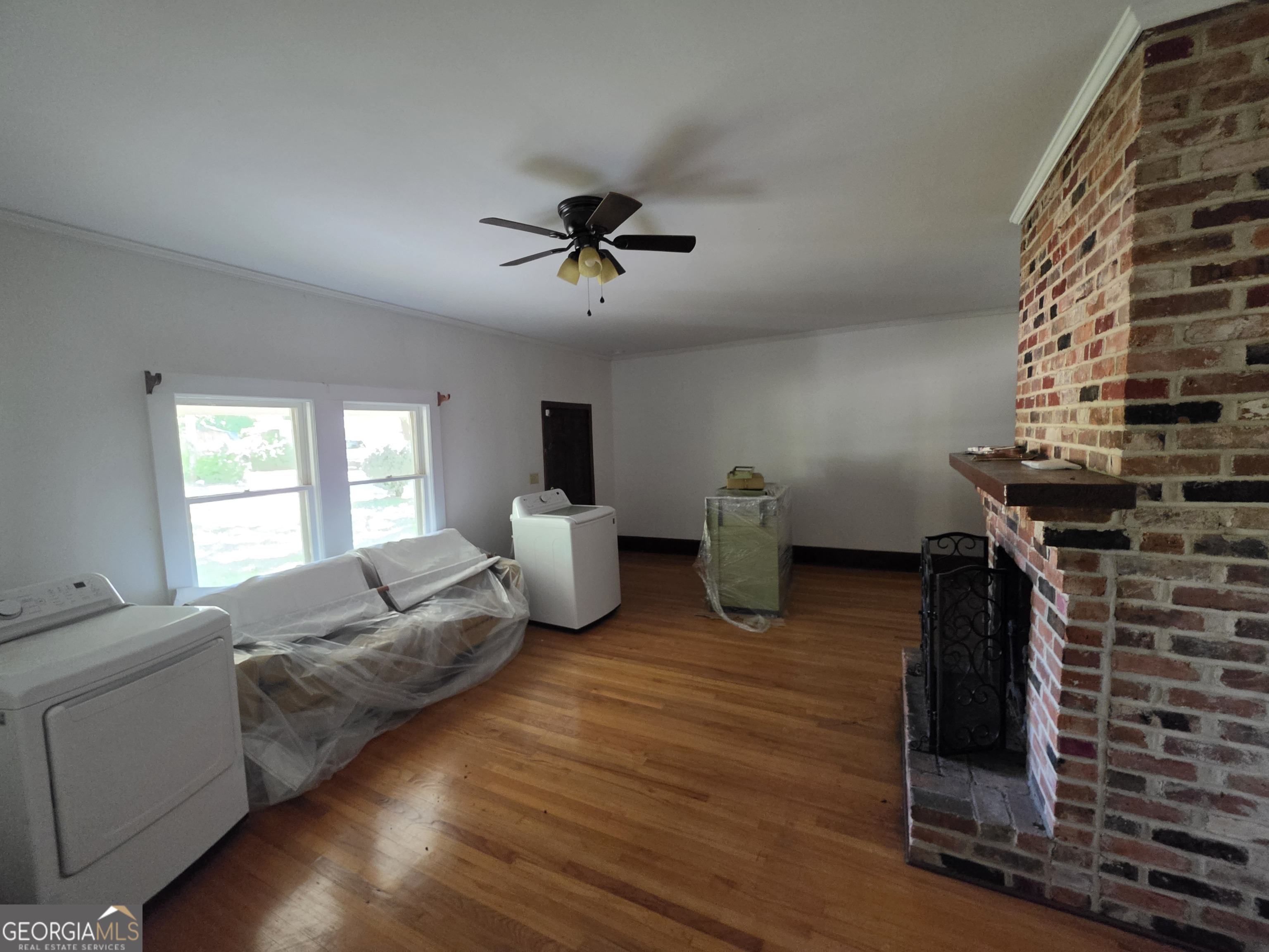 109 Springdale Drive Washington, GA 30673 - Photo 9 of 35 a living room with furniture and wooden floor