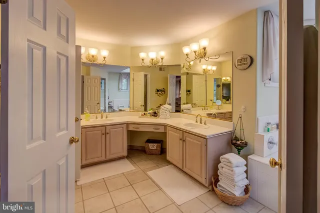 a spacious bathroom with a double vanity sink mirror and