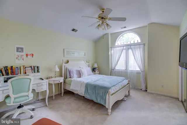 a bed room with a bed and a window