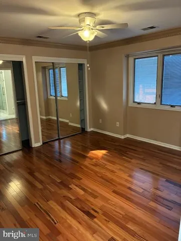 a view of livingroom with hardwood floor and hallway