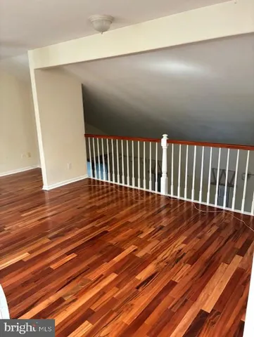 a view of balcony with wooden floor