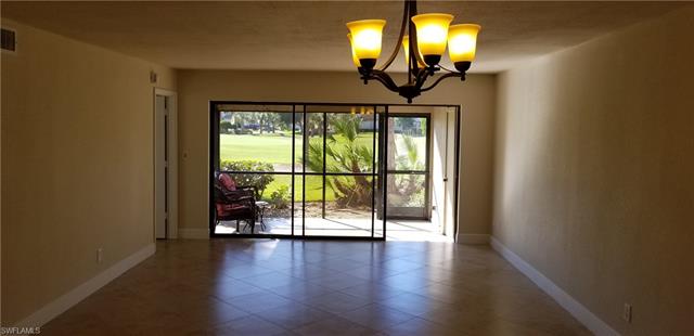 16710 Partridge Place Road, Unit 101 Fort Myers, FL 33908 - Photo 8 of 18 golf course views from your living room and screened, tiled lanai.
