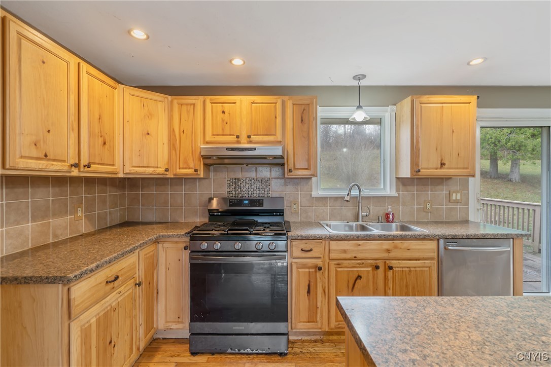3617 Warners Road Camillus, NY 13209 - Photo 12 of 31 Stylish pendant fixtures and recessed lighting are