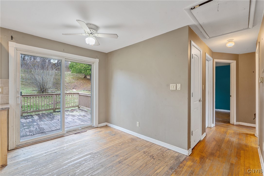 3617 Warners Road Camillus, NY 13209 - Photo 14 of 31 The sliding glass door steps out the deck & lush b