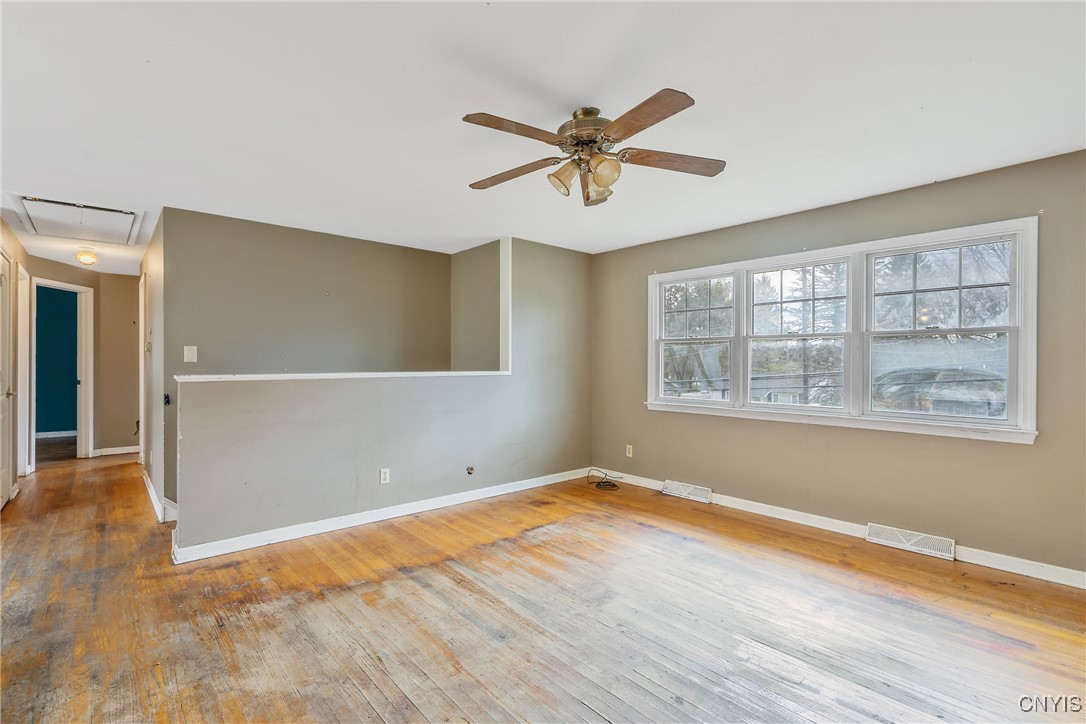 3617 Warners Road Camillus, NY 13209 - Photo 8 of 31 Now we ascend the staircase up to the main level.