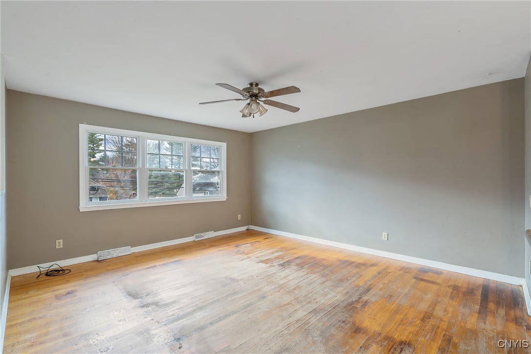 3617 Warners Road Camillus, NY 13209 - Photo 9 of 31 Triple windows at the front look out over the ador