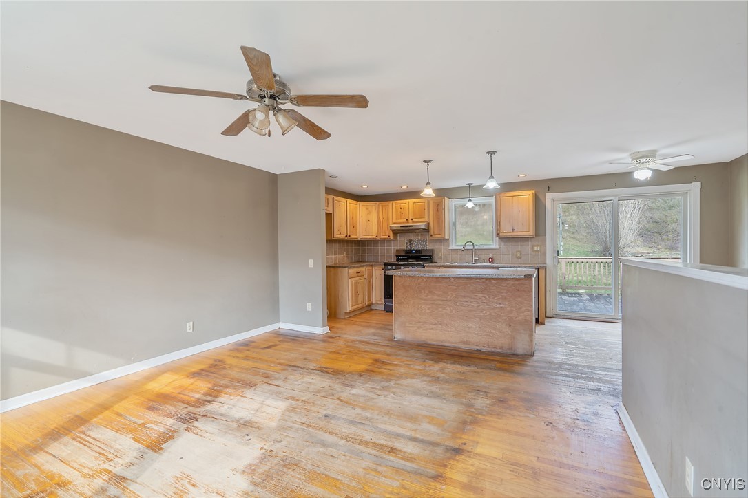 3617 Warners Road Camillus, NY 13209 - Photo 31 of 31 Turning, we see the open floor plan design as we c