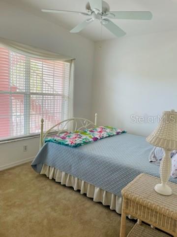 2040 Willow Hammock Circle, Unit 202 Punta Gorda, FL 33983 - Photo 11 of 21 a bedroom with bed and window