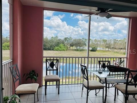 2040 Willow Hammock Circle, Unit 202 Punta Gorda, FL 33983 - Photo 13 of 21 a view of a chair and table in the balcony