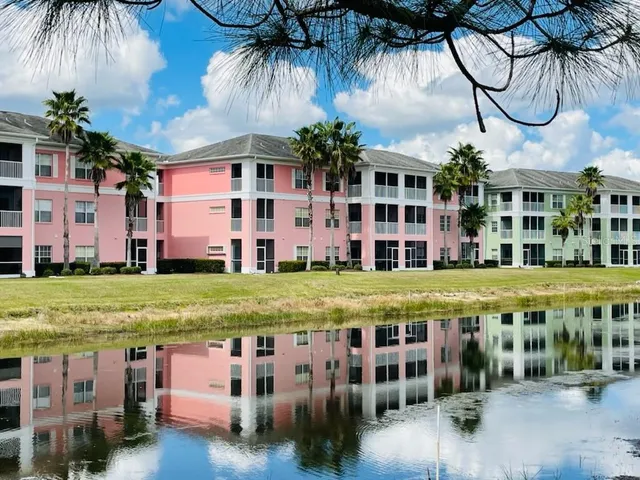 a view of swimming pool with outdoor seating and yard