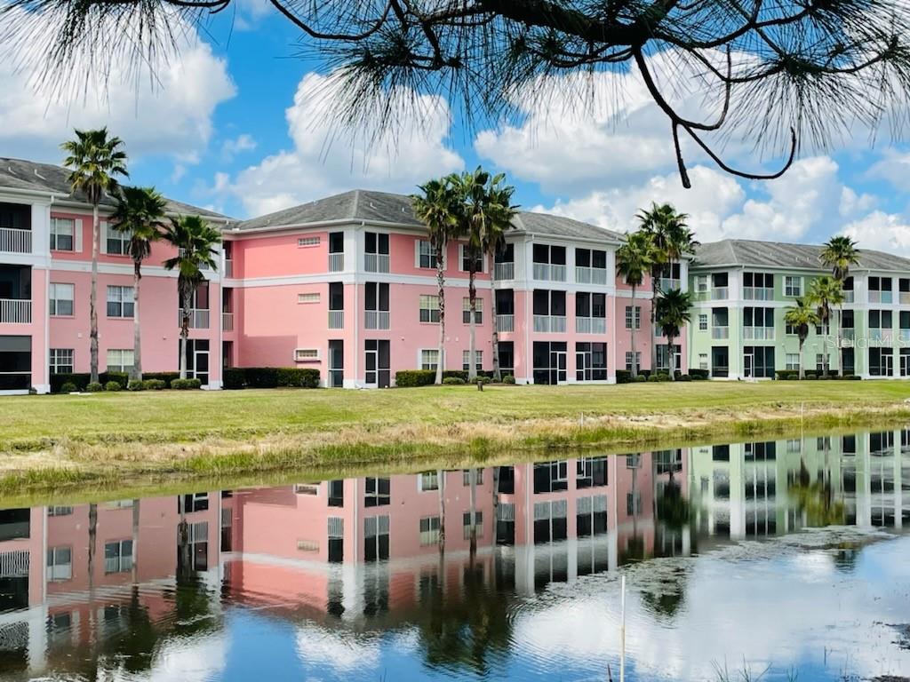 2040 Willow Hammock Circle, Unit 202 Punta Gorda, FL 33983 - Photo 16 of 21 a view of swimming pool with outdoor seating and yard