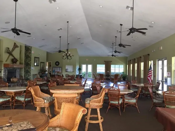 a room with lots of tables and chairs