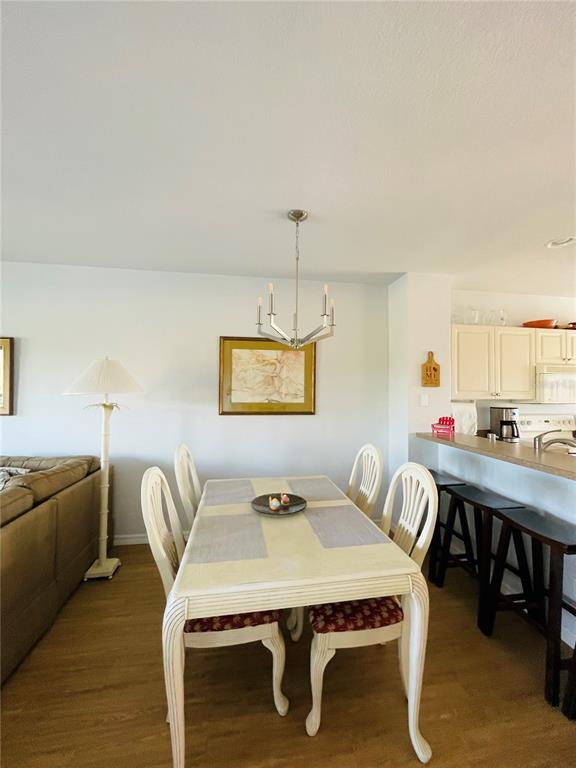2040 Willow Hammock Circle, Unit 202 Punta Gorda, FL 33983 - Photo 5 of 21 a view of a dining room with furniture