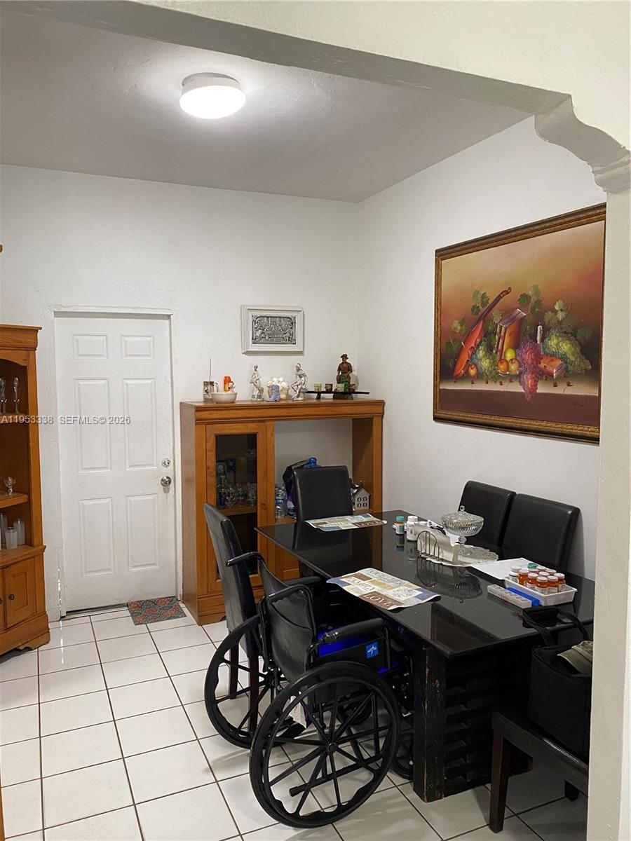 1455 Northwest 112th Street Miami, FL 33167 - Photo 13 of 19 a view of a workspace with furniture