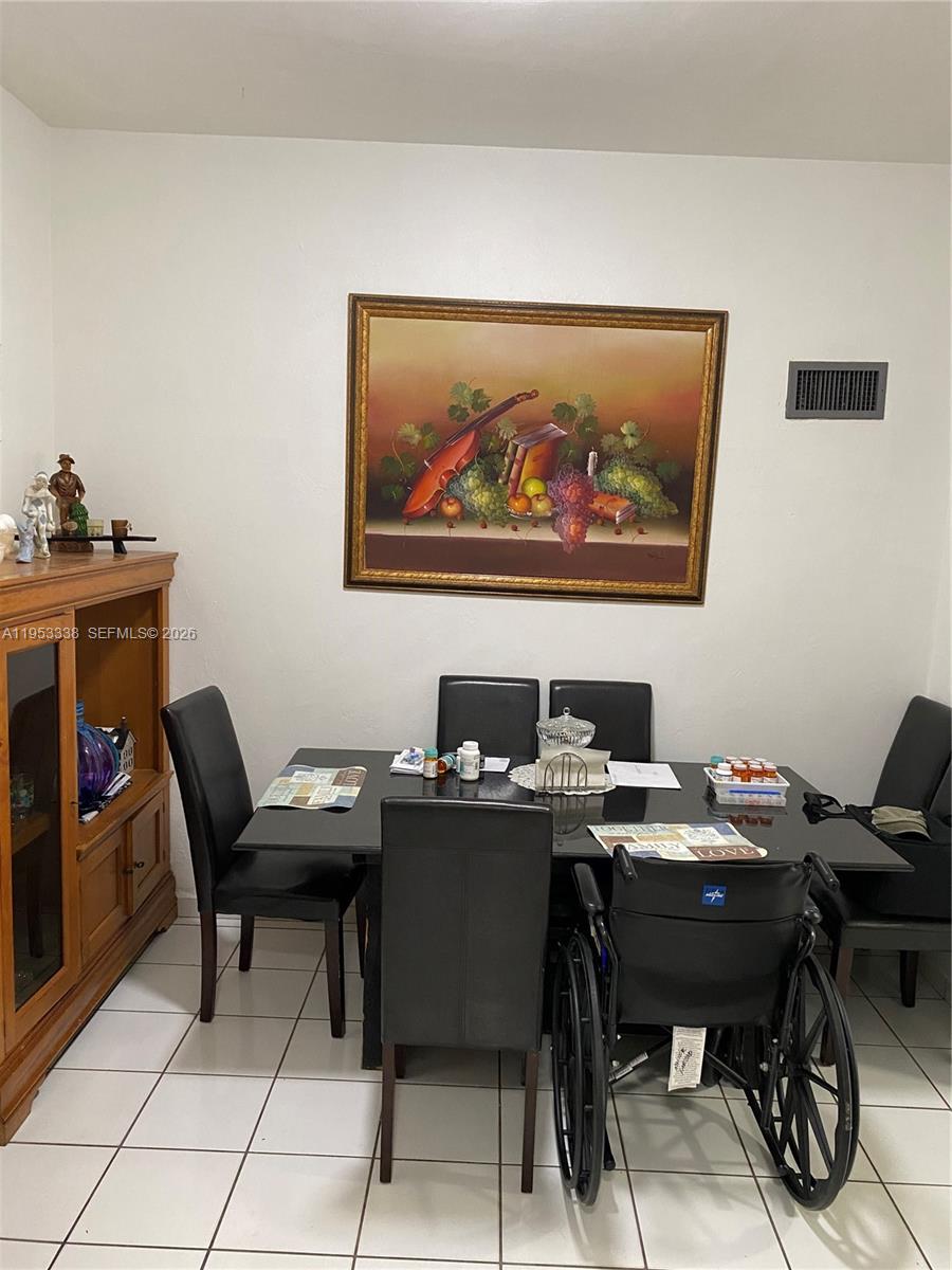 1455 Northwest 112th Street Miami, FL 33167 - Photo 14 of 19 a view of a workspace with furniture