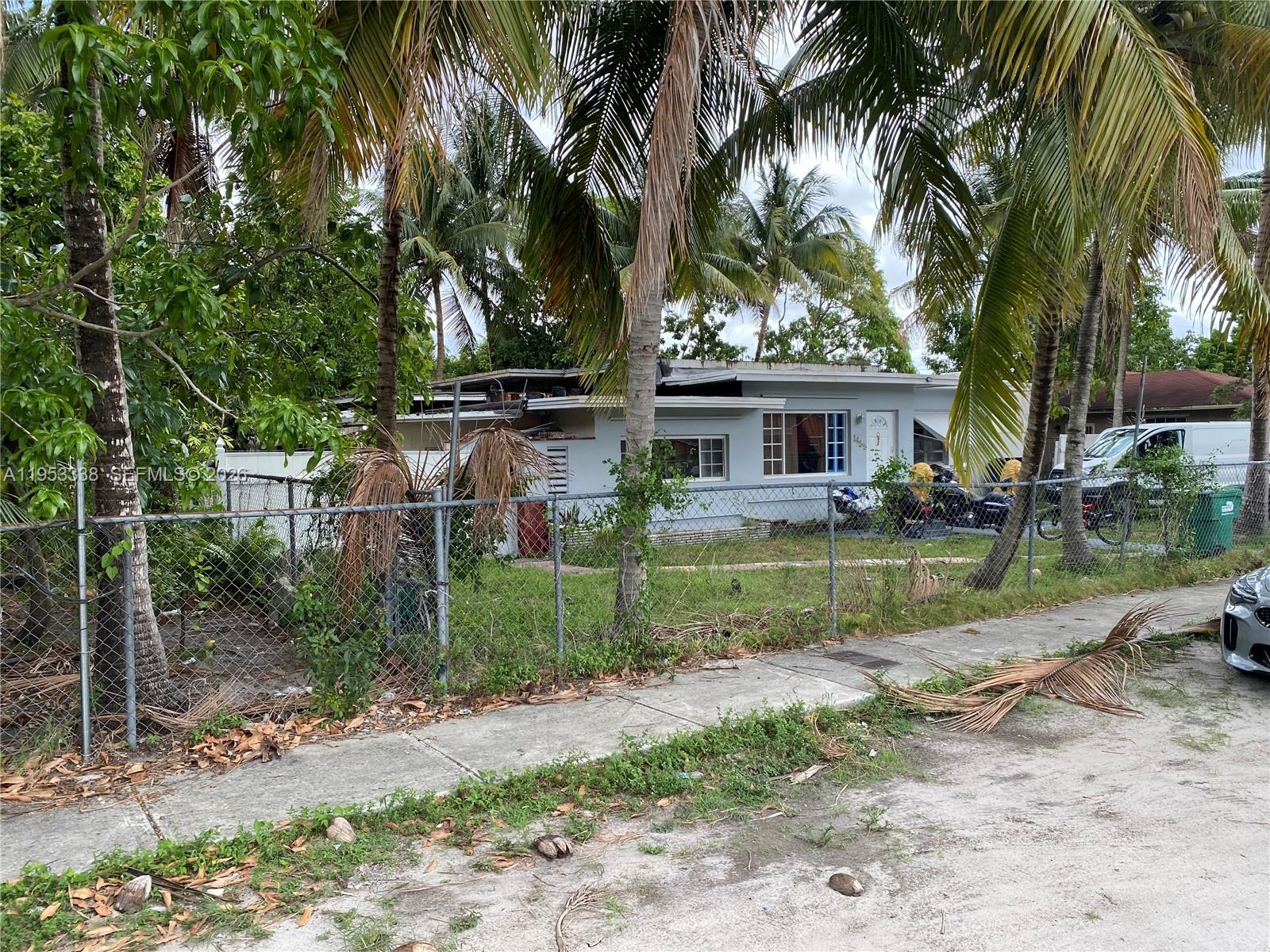 1455 Northwest 112th Street Miami, FL 33167 - Photo 3 of 19 front view of a house with a yard