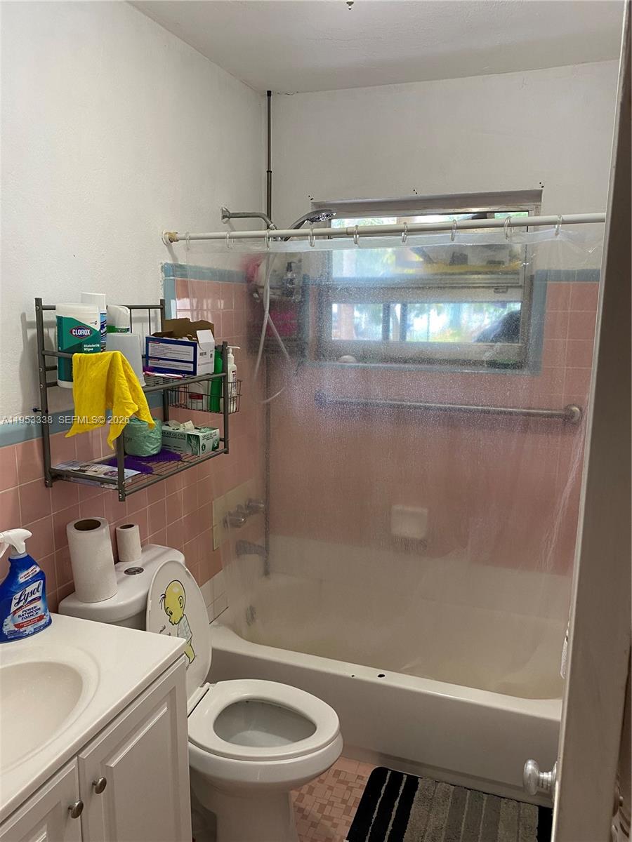 1455 Northwest 112th Street Miami, FL 33167 - Photo 8 of 19 a bathroom with a sink a toilet and shower