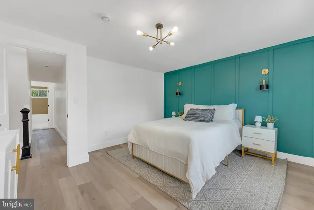 a bed room with a bed and a ceiling fan