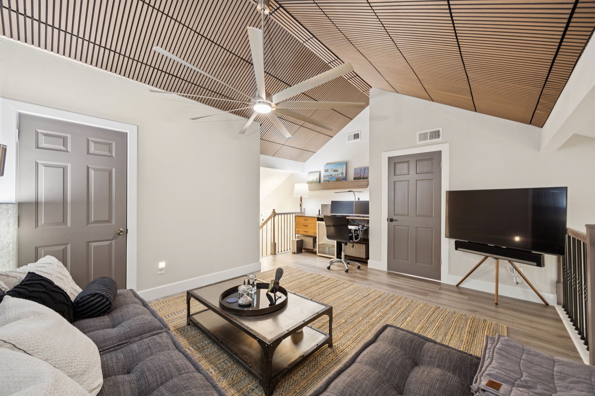 500 River Road, Unit 106 Montgomery, TX 77356 - Photo 24 of 32 Upstairs den provides ample room for a workspace and TV. Through the side door on the left you'll find a large walk-in attic space.