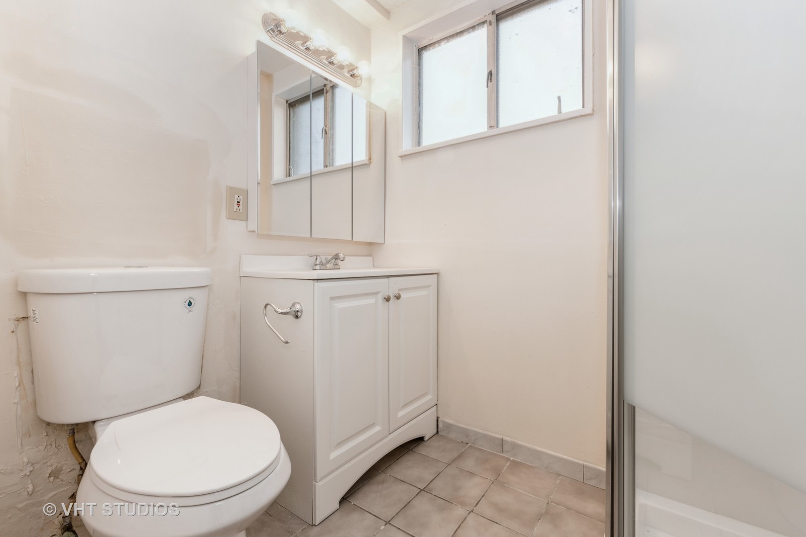 315 Springfield Street Park Forest, IL 60466 - Photo 11 of 13 a white toilet sitting next to a bathroom sink
