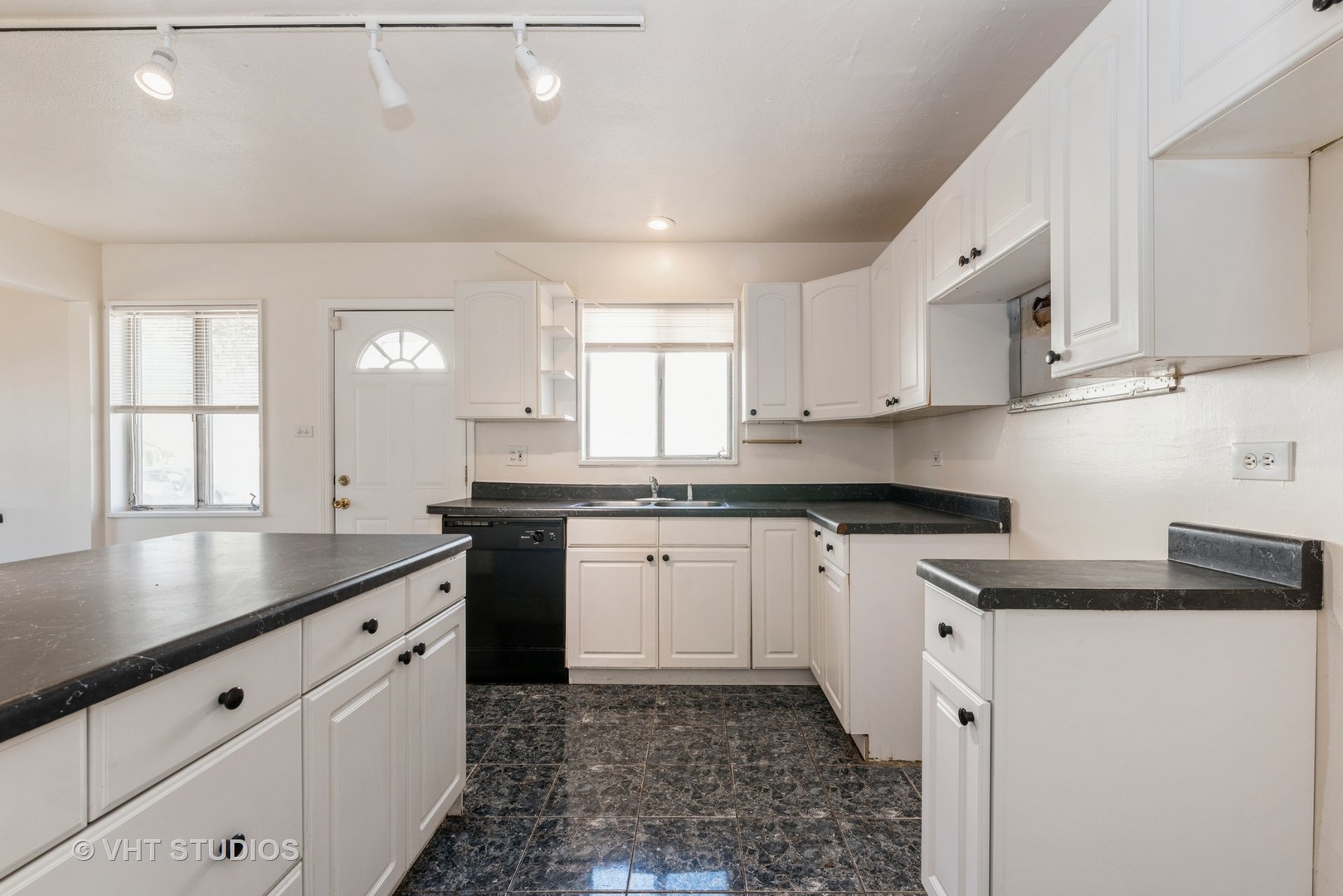 315 Springfield Street Park Forest, IL 60466 - Photo 3 of 13 a kitchen with granite countertop white cabinets white appliances and a sink