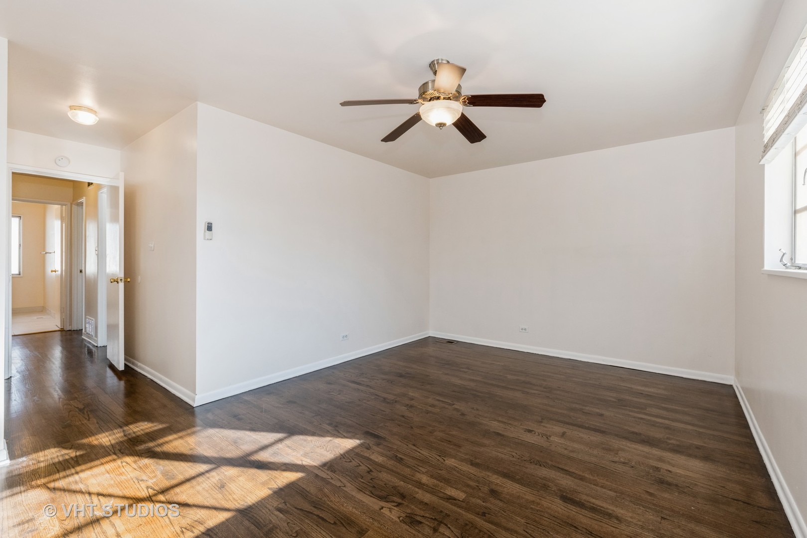 315 Springfield Street Park Forest, IL 60466 - Photo 9 of 13 a view of empty room with wooden floor and fan