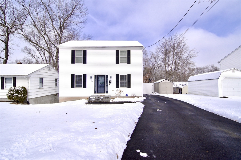 35 Anniversary Street Springfield, MA 01104 - Photo 1 of 37 a view of a white house with a yard