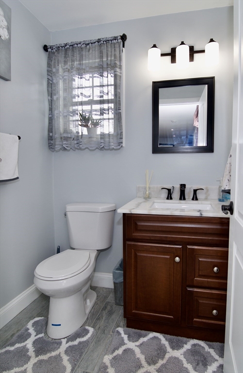 35 Anniversary Street Springfield, MA 01104 - Photo 17 of 37 a bathroom with a toilet sink and mirror
