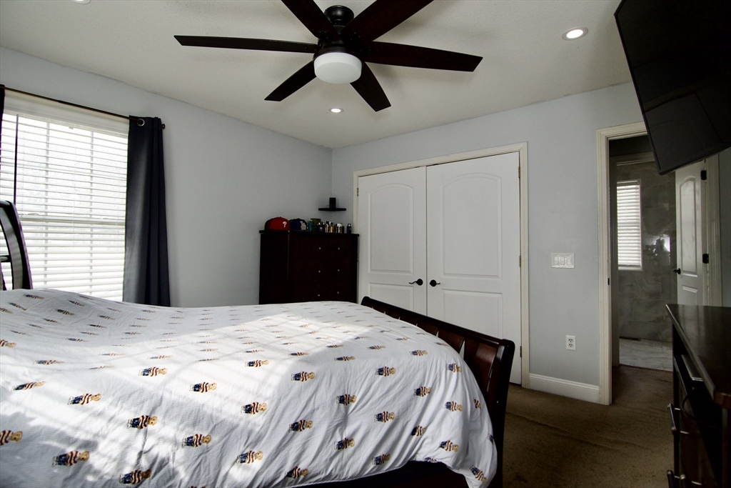 35 Anniversary Street Springfield, MA 01104 - Photo 19 of 37 a bedroom with a bed and a window