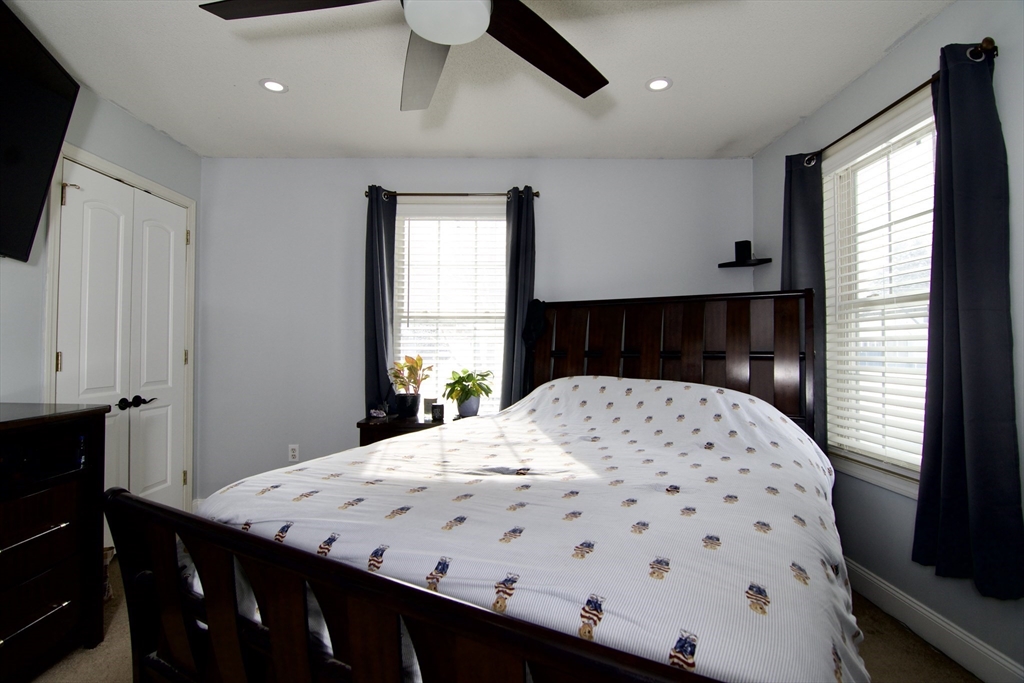 35 Anniversary Street Springfield, MA 01104 - Photo 20 of 37 a bedroom with a bed and a window