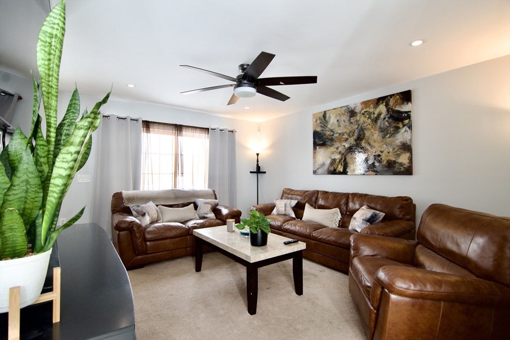 35 Anniversary Street Springfield, MA 01104 - Photo 2 of 37 a living room with furniture and a large window