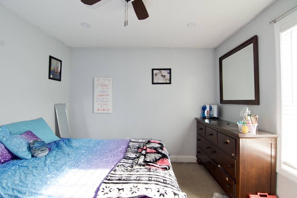 35 Anniversary Street Springfield, MA 01104 - Photo 27 of 37 a bedroom with a bed and a window