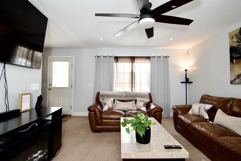 35 Anniversary Street Springfield, MA 01104 - Photo 3 of 37 a living room with furniture and a window