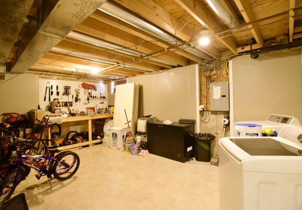 35 Anniversary Street Springfield, MA 01104 - Photo 34 of 37 a storage room with washer and dryer
