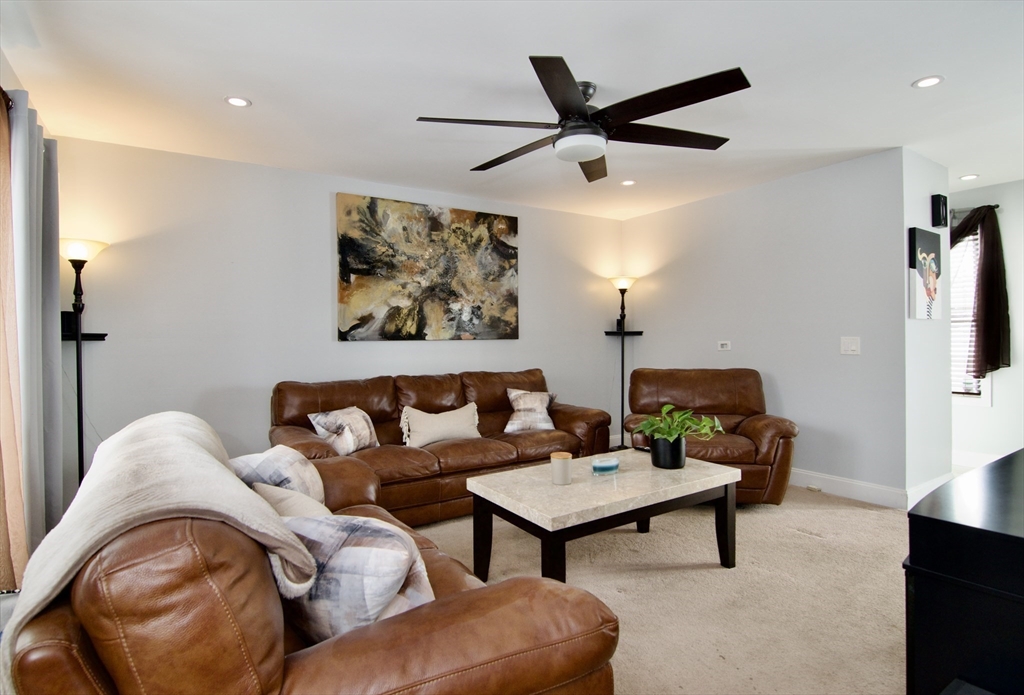 35 Anniversary Street Springfield, MA 01104 - Photo 5 of 37 a living room with furniture and a ceiling fan