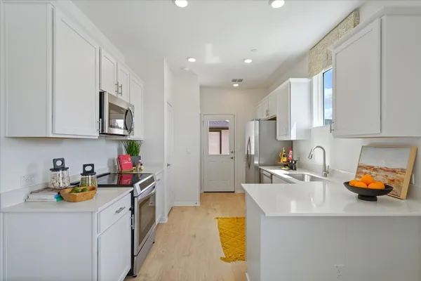 a dining room with furniture and a window