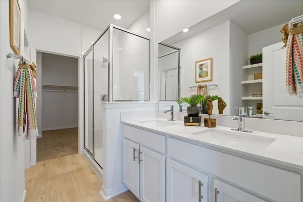 a view of a backyard with couches floor to ceiling window and potted plants