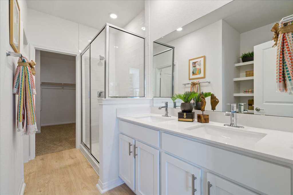 2513 Caleb Asher Loop Round Rock, TX 78665 - Photo 18 of 40 a bathroom with a double vanity sink mirror and double
