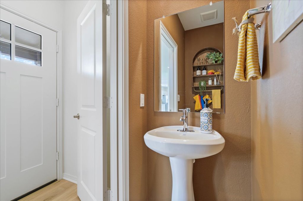 2513 Caleb Asher Loop Round Rock, TX 78665 - Photo 20 of 40 a bathroom with a sink and a mirror