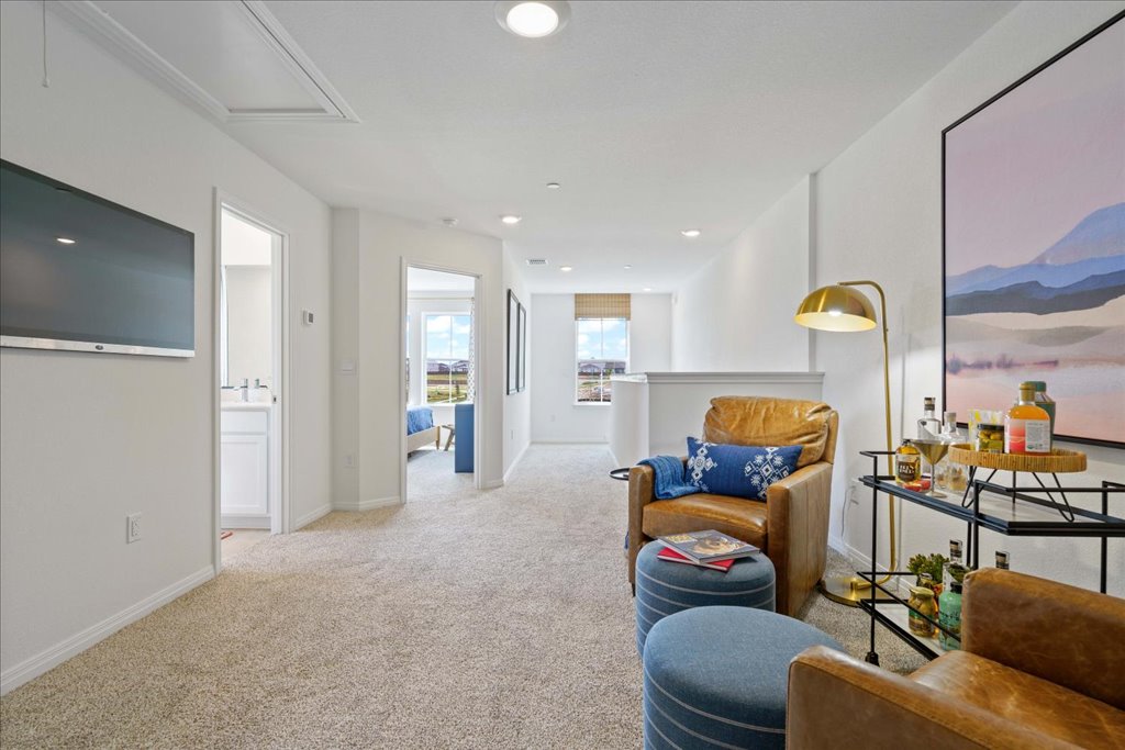 2513 Caleb Asher Loop Round Rock, TX 78665 - Photo 23 of 40 a living room with furniture and a chandelier