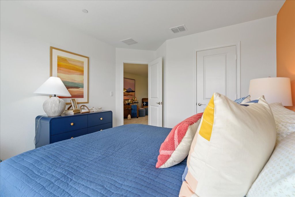 2513 Caleb Asher Loop Round Rock, TX 78665 - Photo 24 of 40 a bedroom with a bed and a dresser