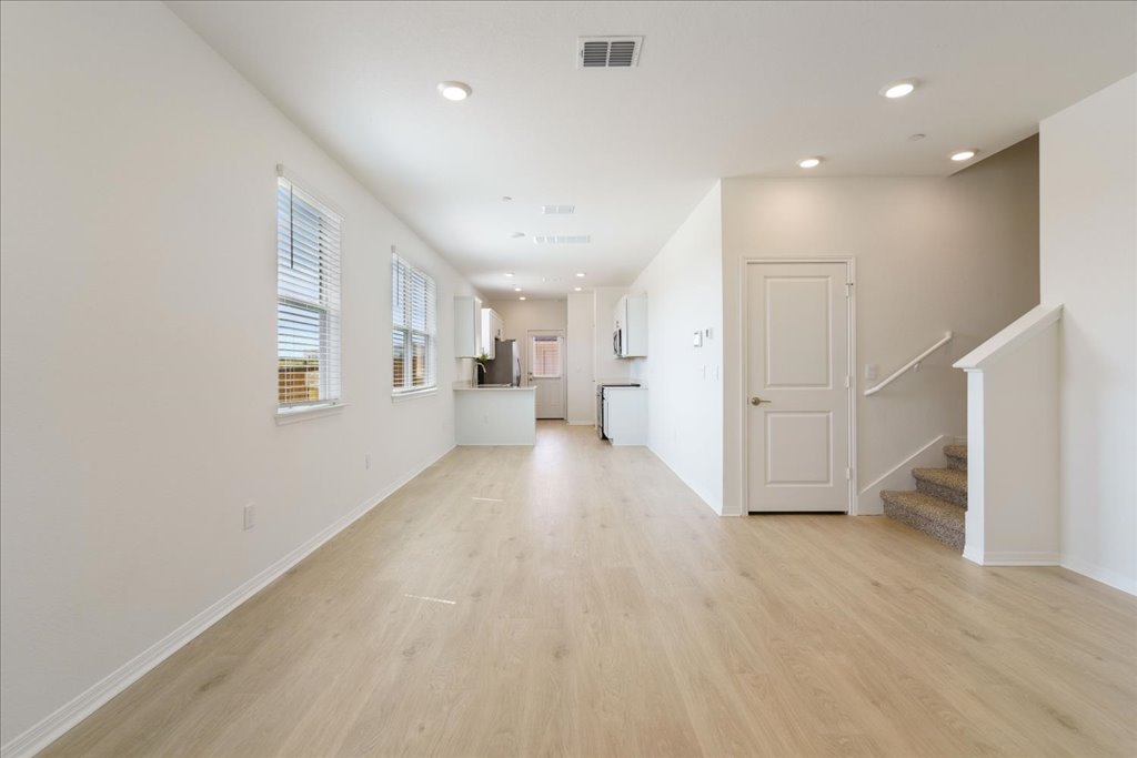 2513 Caleb Asher Loop Round Rock, TX 78665 - Photo 26 of 40 a view of empty room with wooden floor