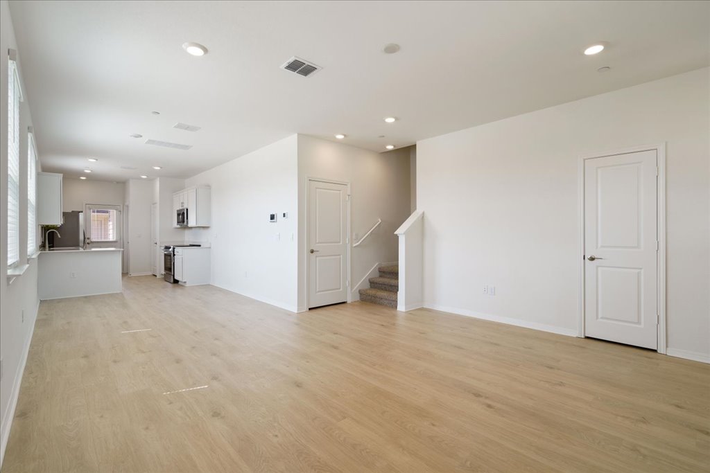 2513 Caleb Asher Loop Round Rock, TX 78665 - Photo 27 of 40 an empty room with white cabinet and windows