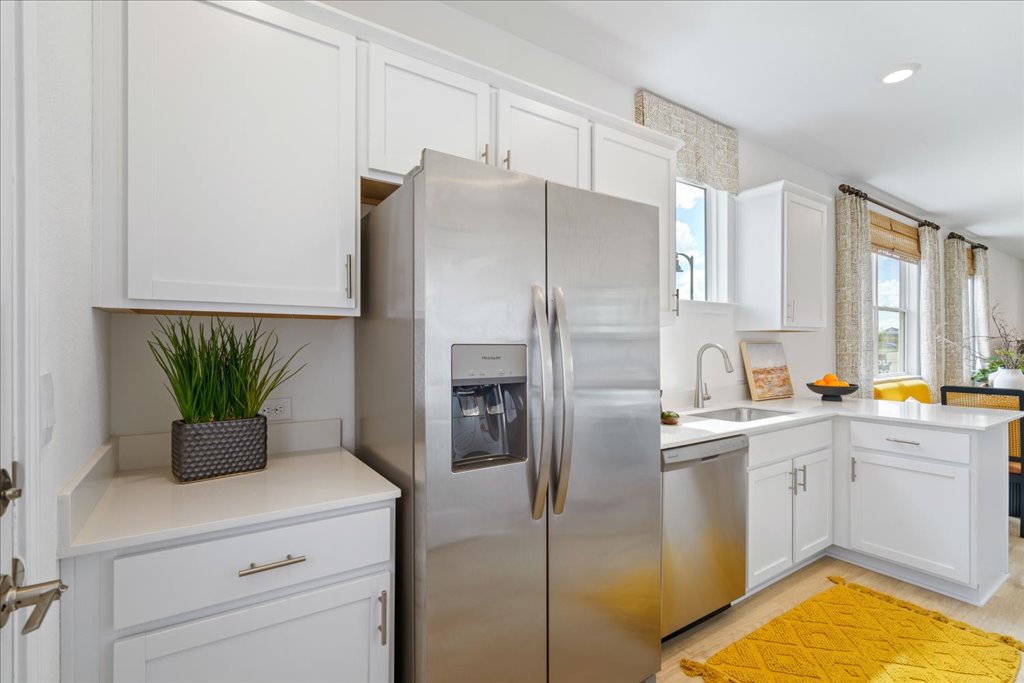 2513 Caleb Asher Loop Round Rock, TX 78665 - Photo 3 of 40 a kitchen with stainless steel appliances a refrigerator sink and cabinets